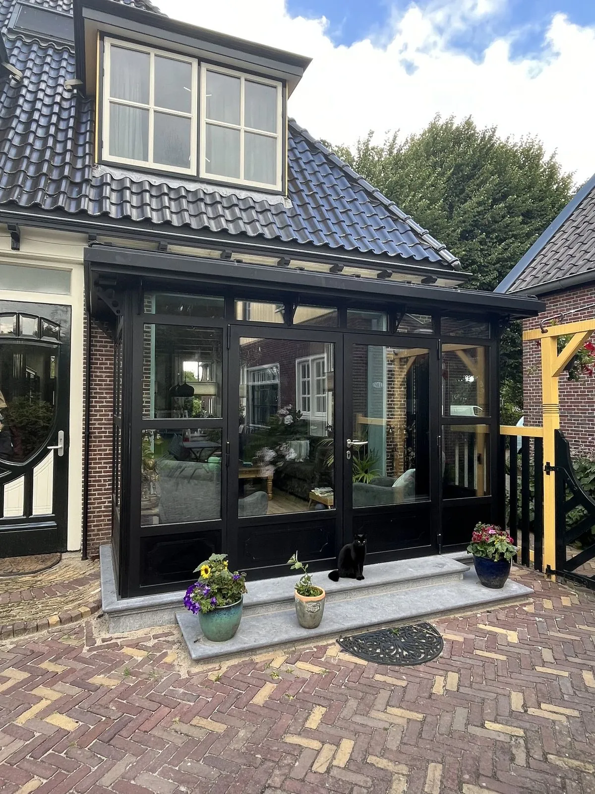 Serre aan de tuinzijde van een woning